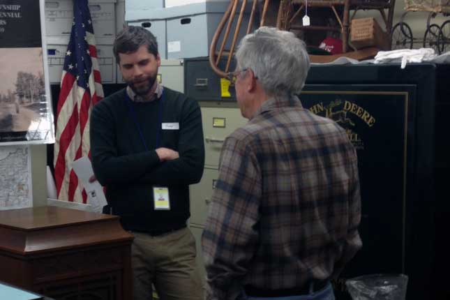 Informal meeting of two people talking in a museum exhibit